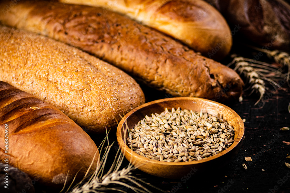 Various bread with grain in a bowl on the table. 