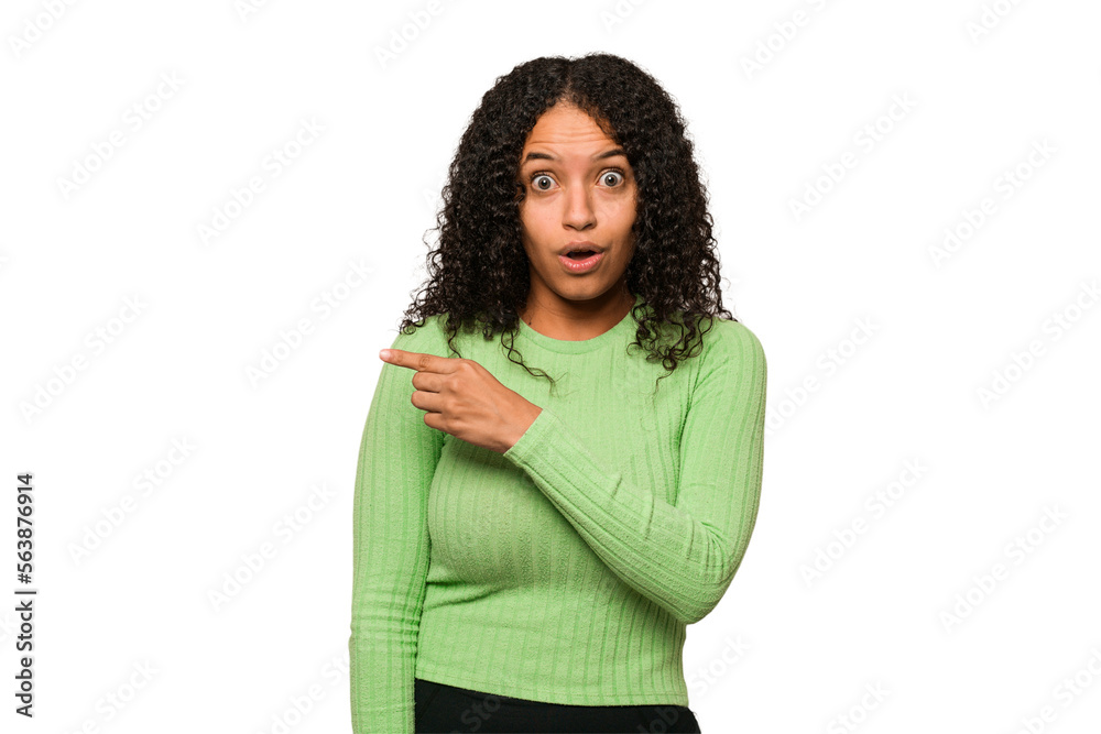 Young african american curly woman isolated pointing to the side Young african american curly woman isolated pointing to the side
