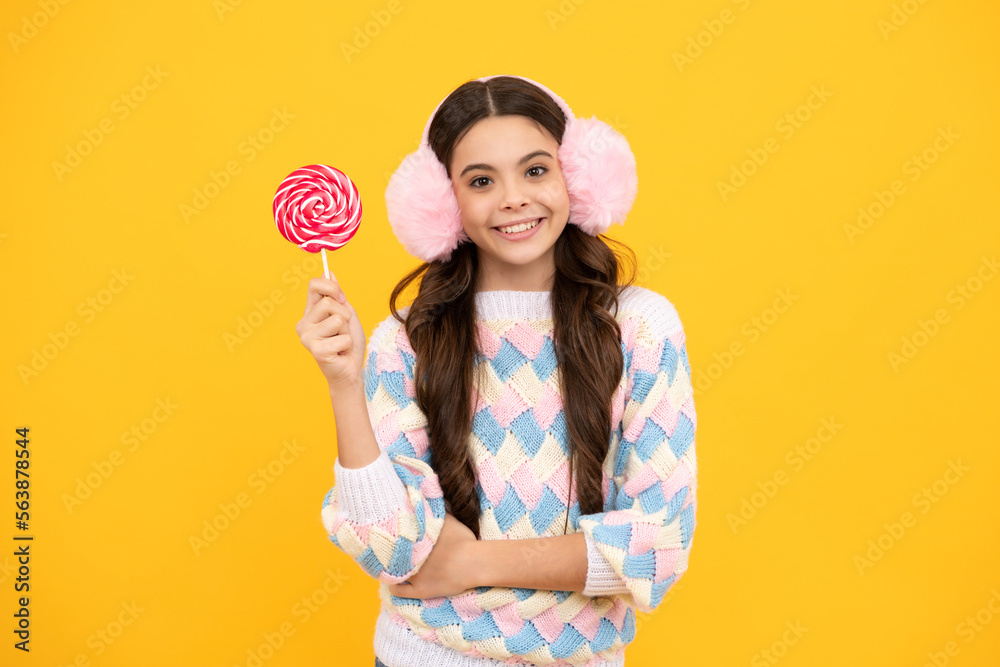 Teenage girl with candy lollipop, happy child 12, 13, 14 years old eating big sugar lollipop, sweets candy. Teenage girl with candy lollipop, happy child 12, 13, 14 years old eating big sugar lollipop, sweets candy.