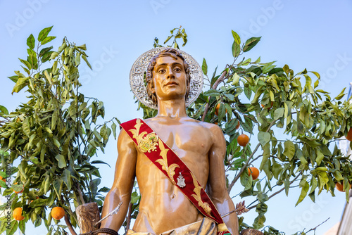 Fotografi Detail  of the Patron Saint Sebastian (San Sebastian)  in procession through the