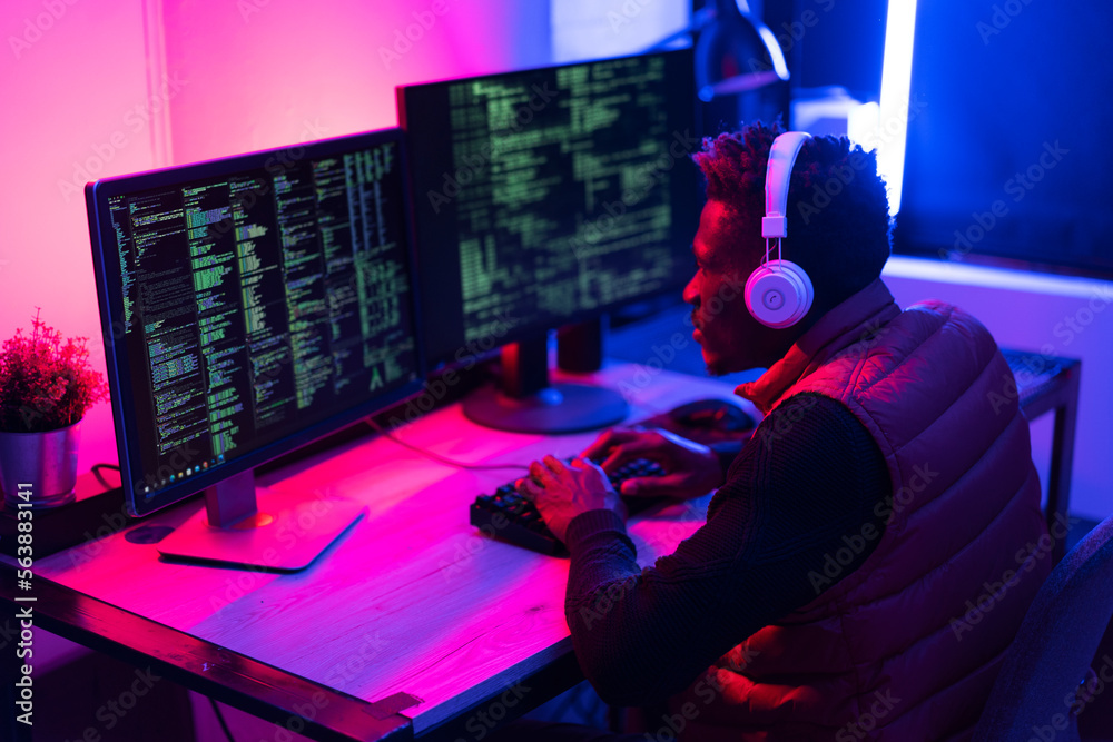 Software developer coding on his computer. Coding and hacking concept.. Software developer coding on his computer. Coding and hacking concept..
