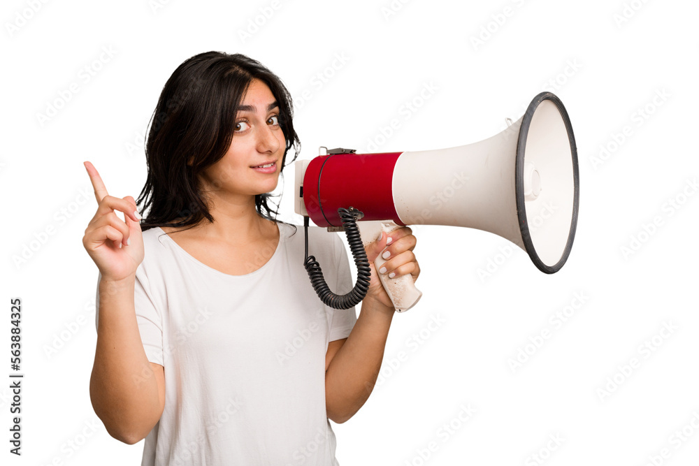 Young Indian woman holding a megaphone isolated