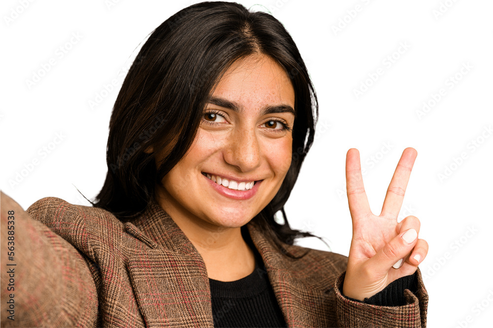 Young indian woman doing a selfie with mobile isolated Young indian woman doing a selfie with mobile isolated