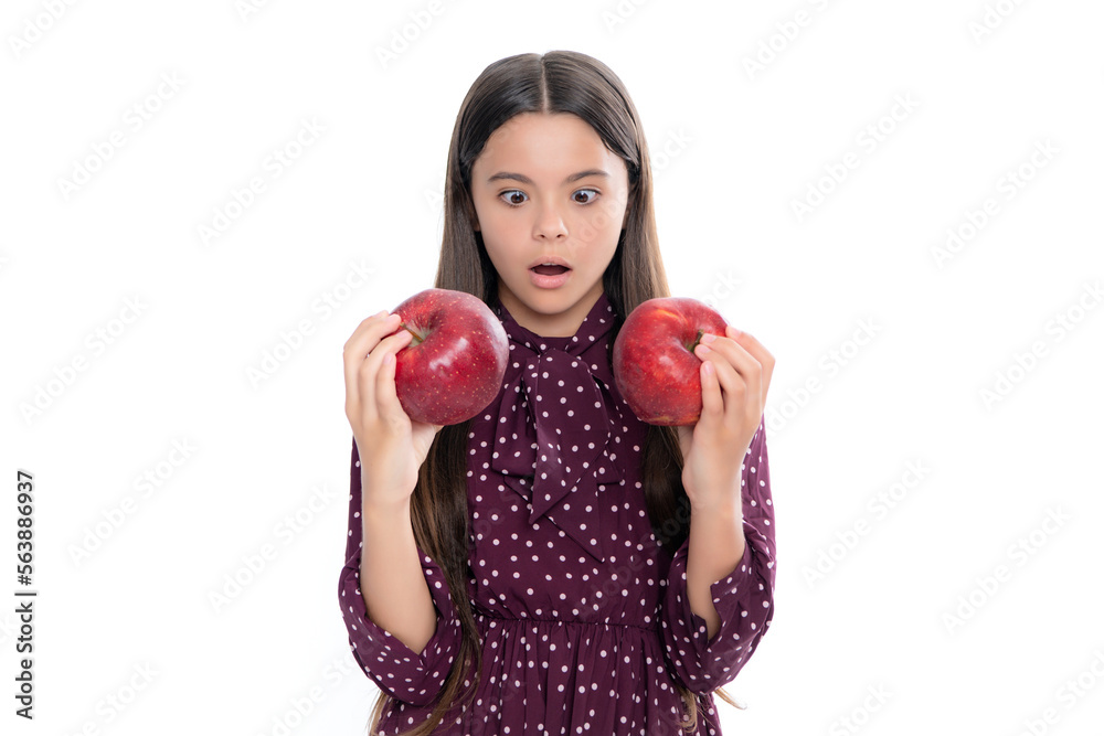 Child girl eating an apple over isolated white studio background. Tennager with fruit. Portrait of happy funny smiling teenage child girl. Child girl eating an apple over isolated white studio background. Tennager with fruit. Portrait of happy funny smiling teenage child girl.