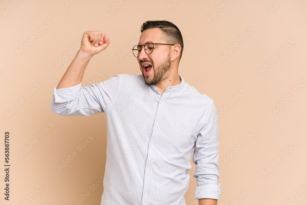 Adult latin man cut out isolated celebrating a victory, passion and enthusiasm, happy expression. Adult latin man cut out isolated celebrating a victory, passion and enthusiasm, happy expression.