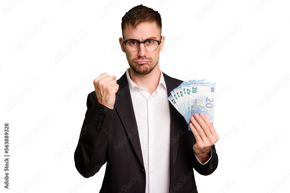 Young business caucasian man holding euro banknotes isolated cut out showing fist to camera, aggressive facial expression. Young business caucasian man holding euro banknotes isolated cut out showing fist to camera, aggressive facial expression.