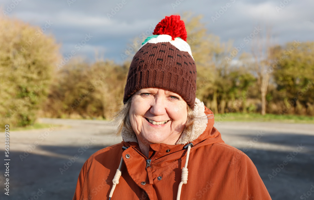 Woman smiling wearing a Christmas novelty hat Woman smiling wearing a Christmas novelty hat