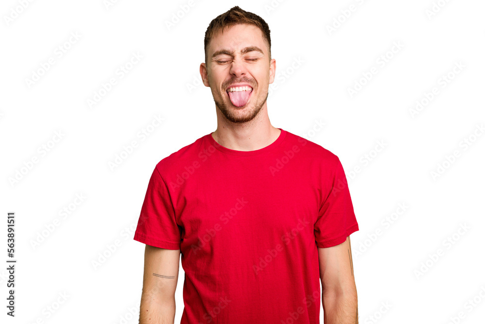 Obraz premium Young caucasian man cut out isolated funny and friendly sticking out tongue.