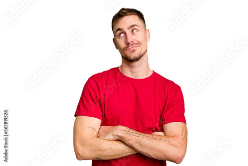 Young caucasian man cut out isolated dreaming of achieving goals and purposes