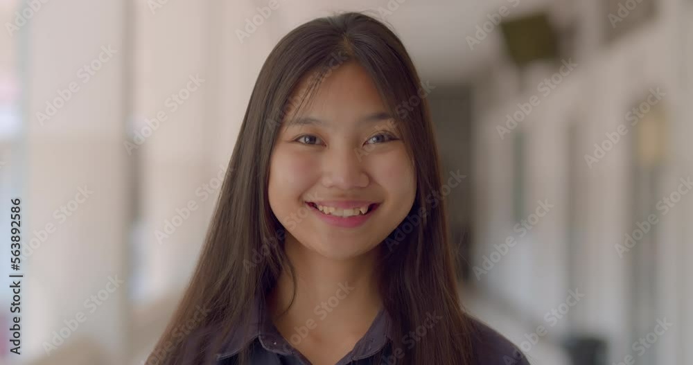 A cute happy smile and bright eyes Asian high school long haired teenage girl. A cute happy smile and bright eyes Asian high school long haired teenage girl.