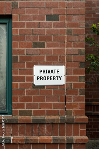 Private property sign. Blank sign on a brick wall background. Copy space for text.
