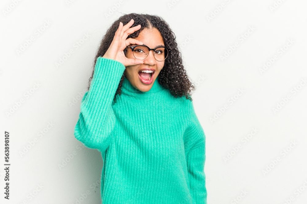Young african american woman isolated on white background excited keeping ok gesture on eye. Young african american woman isolated on white background excited keeping ok gesture on eye.