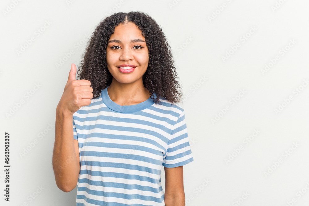 Young african american woman isolated on white background smiling and raising thumb up Young african american woman isolated on white background smiling and raising thumb up