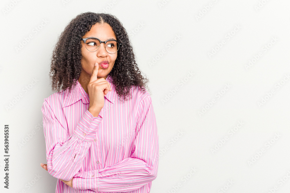Young african american woman isolated on white background looking sideways with doubtful and skeptical expression. Young african american woman isolated on white background looking sideways with doubtful and skeptical expression.