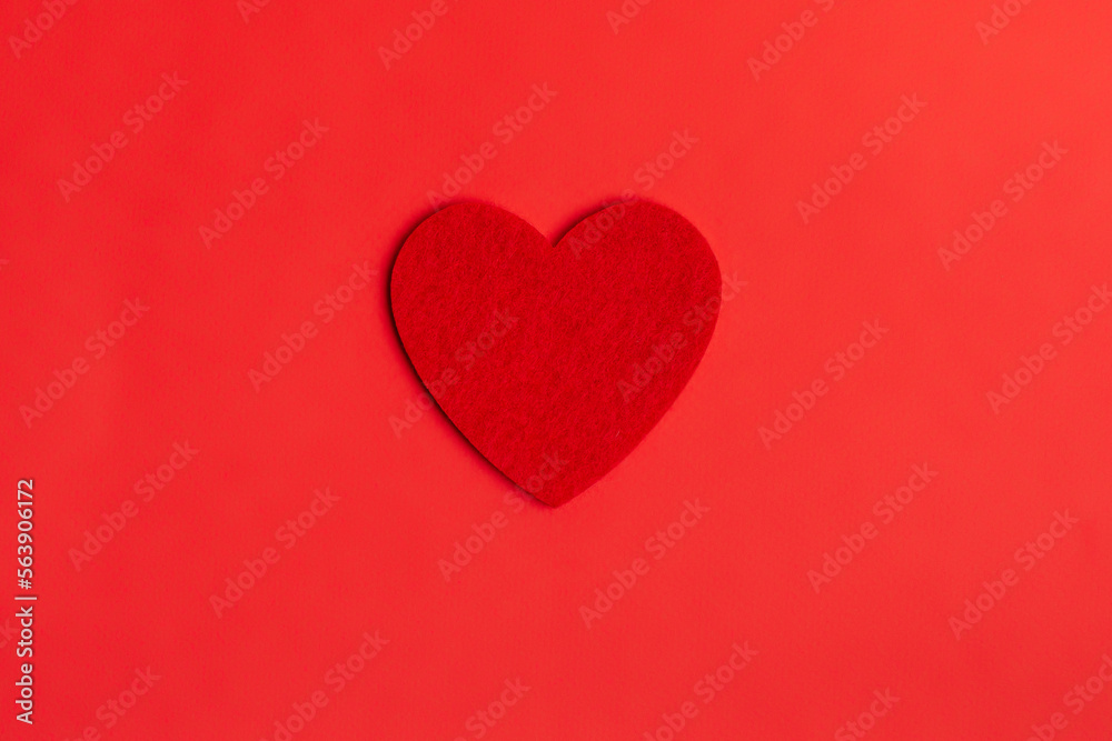 Red heart flat lay on red background. Valentine's Day concept.