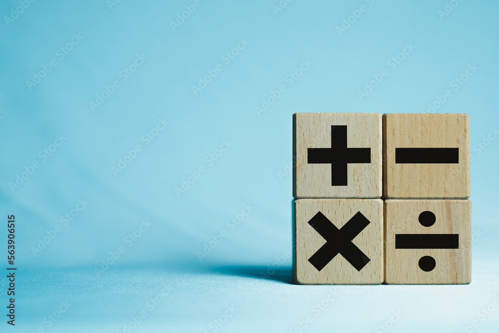 Image of wooden cubes displaying mathematical operation icons of Plus ...