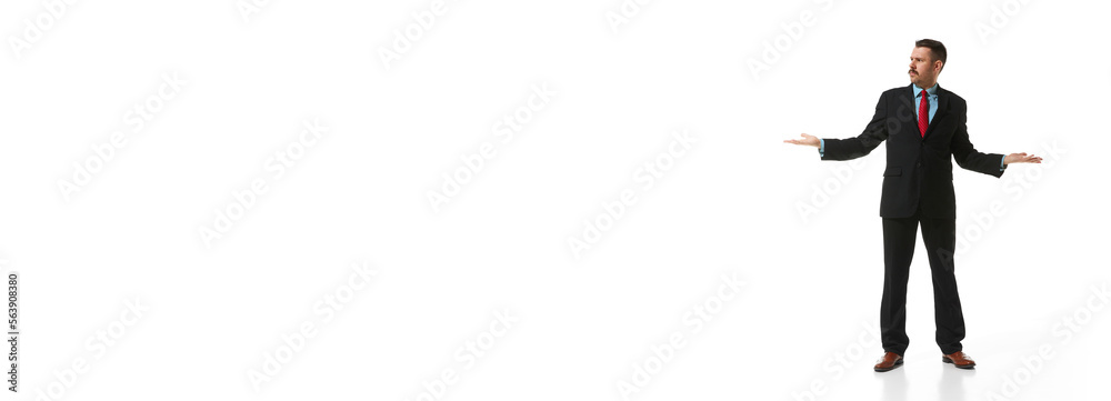 Businessman in a suit spreading hand with questioning face over white studio background. Banner, flyer. Concept of business, career, innovations, ad