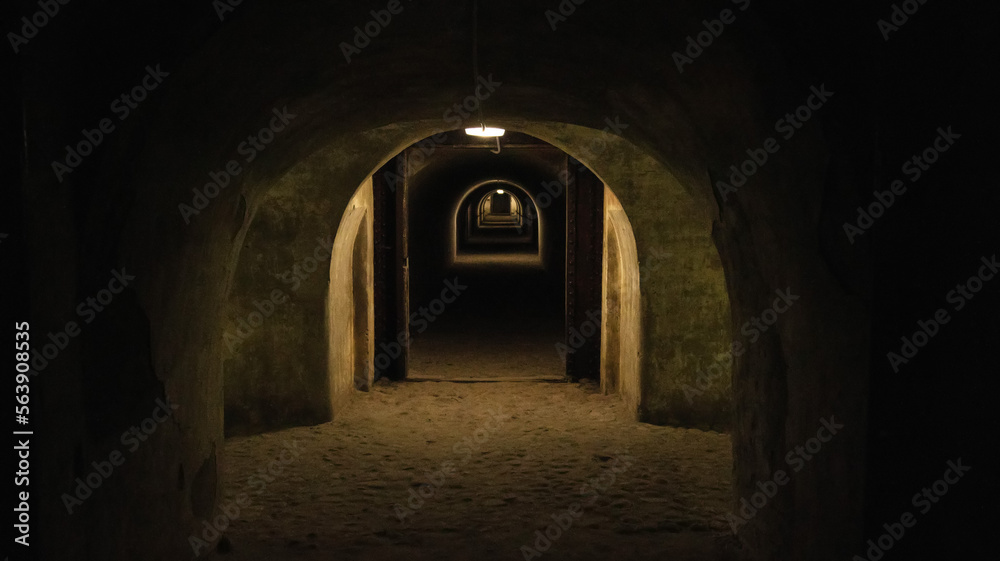 First person view walking through the military tunnel in the dungeon. Defensive structure, casemates. Bomb shelter during the war. Copy space for text