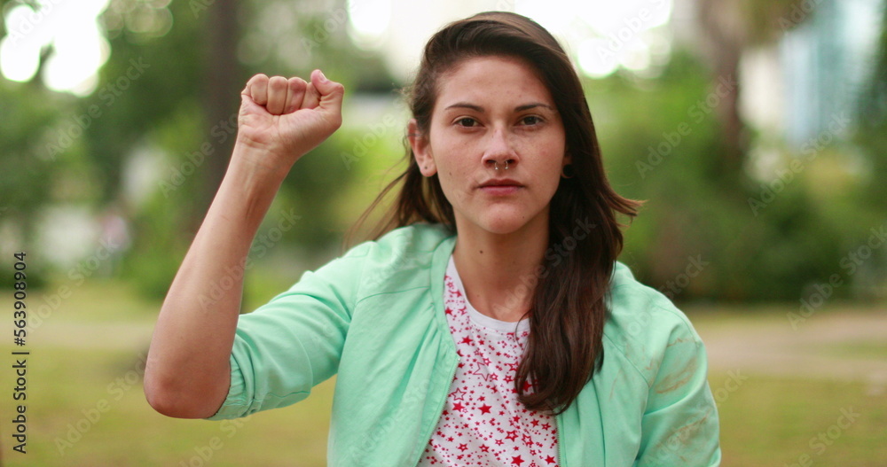 Woman raising hand. Powerful woman lifting fist symbol Woman raising hand. Powerful woman lifting fist symbol