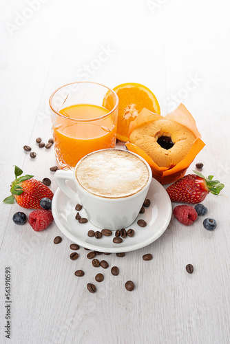 Breakfast with coffee, muffins, orange juice and fresh fruit