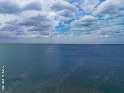 Aerial view of a blue sea surface water texture background and sun reflections Aerial flying drone view Waves water surface texture on sunny tropical ocean