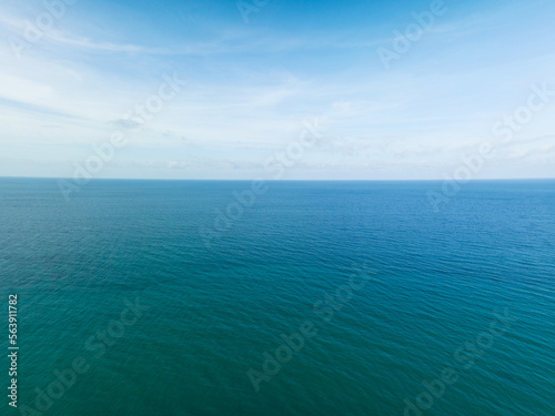 Aerial view of a blue sea surface water texture background and sun reflections Aerial flying drone view Waves water surface texture on sunny tropical ocean