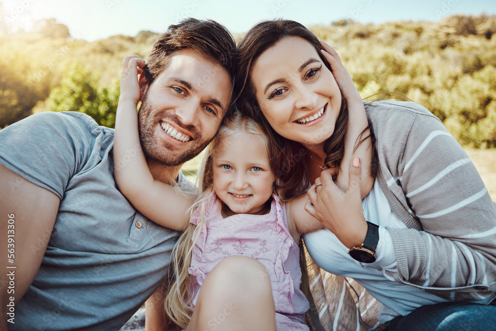 Fototapeta premium Portrait of mother, father and girl at park enjoying quality time in holiday, weekend and vacation together. Family, love and happy child with parents smile for bonding, relax and adventure in summer