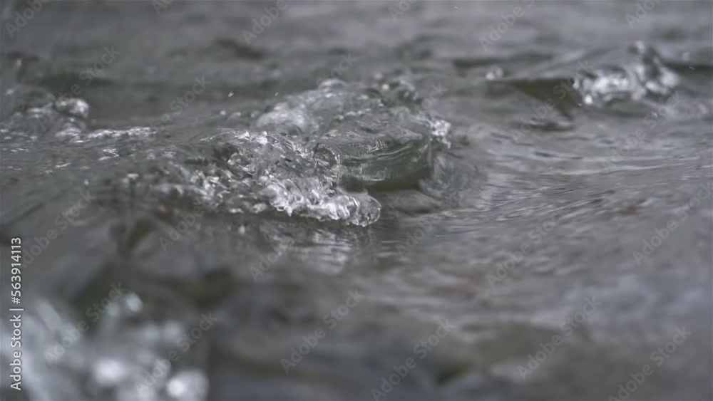 Crystal clean water flowing in mountain stream river nature background Crystal clean water flowing in mountain stream river nature background