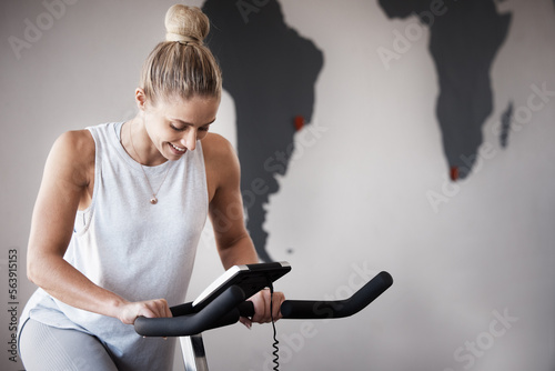 Fitness, gym bike and woman cycling for cardio performance, body wellness and exercise mockup. Health goals, spin bicycle mock up or athlete girl happy for workout, sports training or power challenge photo