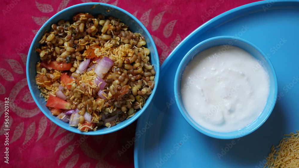 Spicy Misal Pav or usal Pav is a traditional and popular snack or Chat food from Maharashtra, India. Served with chopped onion, lemon wedges and farsan.Selective focus with copy space Spicy Misal Pav or usal Pav is a traditional and popular snack or Chat food from Maharashtra, India. Served with chopped onion, lemon wedges and farsan.Selective focus with copy space