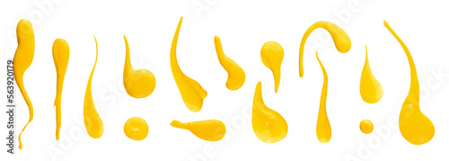 Set of yellow drops and splashes of cheese sauce or mustard isolated on white background. With clipping path. Full depth of field. Focus stacking. PNG photo