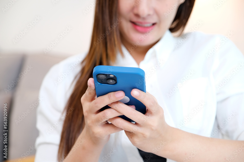Close up of young asian woman using phone with smiling, happy and relax emotion, Happy asia girl on phone, people and technology, lifestyle Close up of young asian woman using phone with smiling, happy and relax emotion, Happy asia girl on phone, people and technology, lifestyle