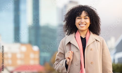 Business woman, portrait and smily of a young professional happy with a smile by urban building. Worker, smiling and happiness of a female by buildings excited about work success with mock up space