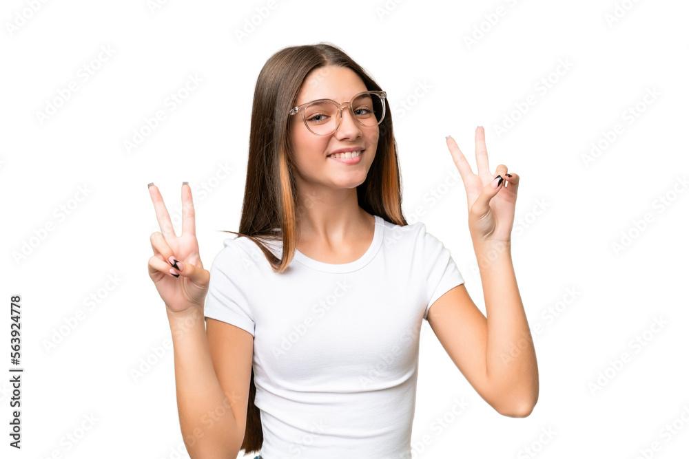Teenager caucasian girl over isolated background showing victory sign with both hands Teenager caucasian girl over isolated background showing victory sign with both hands