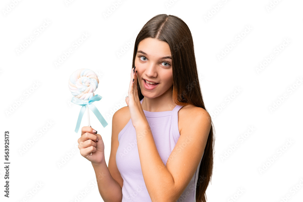Teenager caucasian girl holding a lollipop over isolated background whispering something Teenager caucasian girl holding a lollipop over isolated background whispering something