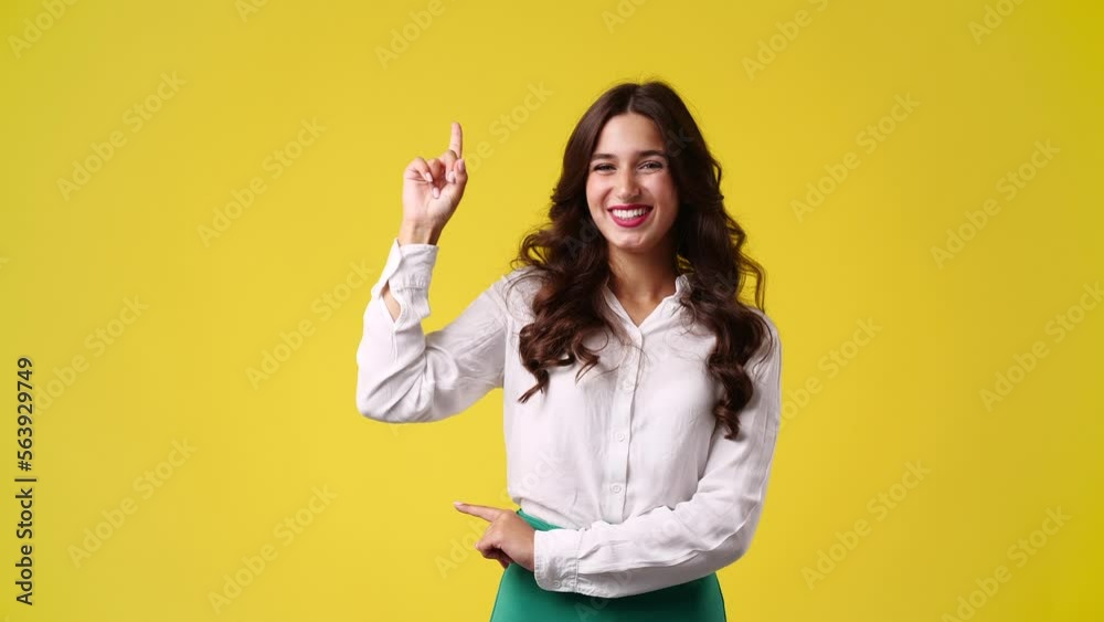 4k slow motion video of girl with cunning facial expression on yellow background. 4k slow motion video of girl with cunning facial expression on yellow background.