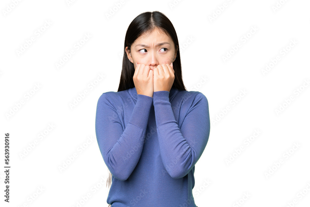 Young Asian woman over isolated chroma key background nervous and scared putting hands to mouth Young Asian woman over isolated chroma key background nervous and scared putting hands to mouth