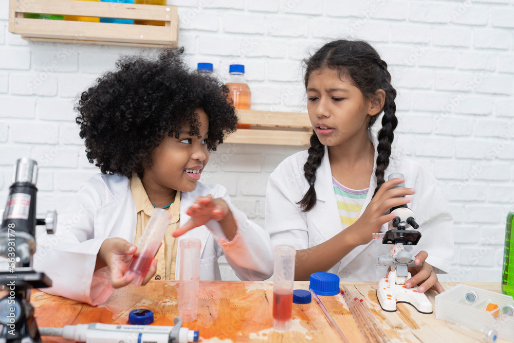 Elementary School Science student have fun playing biochemistry research in chemistry class room