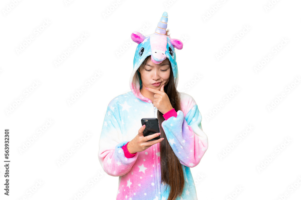 Young Asian woman with unicorn pajamas over isolated chroma key background thinking and sending a message Young Asian woman with unicorn pajamas over isolated chroma key background thinking and sending a message