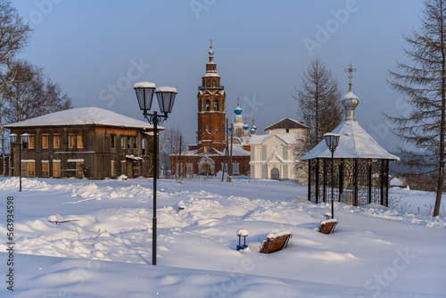 The ancient architecture is surrounded by tall white drifts and blue skies.