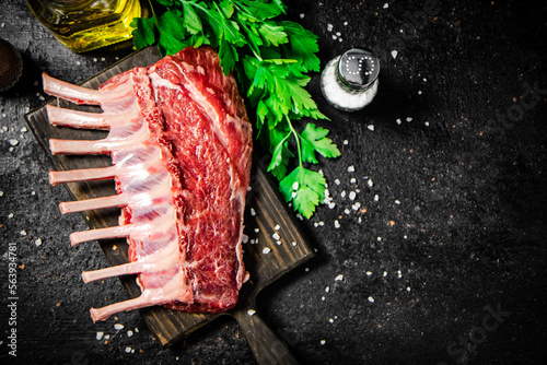 Raw rack of lamb with parsley and oil. 
