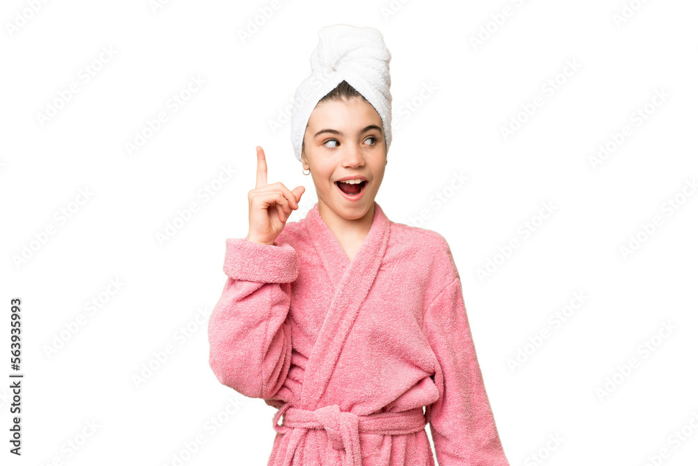 Little girl in a bathrobe over isolated chroma key background intending to realizes the solution while lifting a finger up Little girl in a bathrobe over isolated chroma key background intending to realizes the solution while lifting a finger up