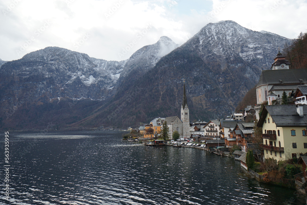 Stunning view of the Hallstatt village surrounded by mountains and beautiful nature in winter.	
