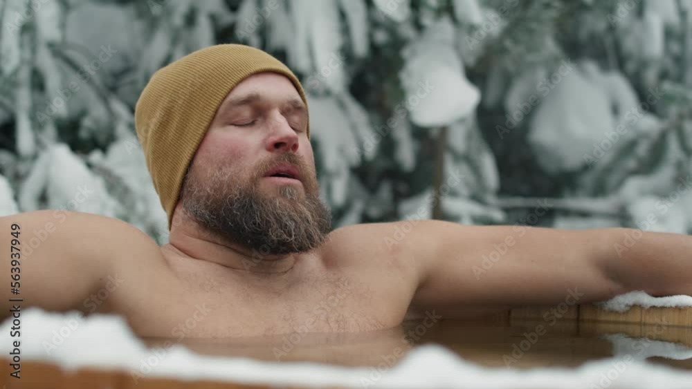 Caucasian man during the winter bath in tube outdoors. Shot with RED helium camera in 8K. Caucasian man during the winter bath in tube outdoors. Shot with RED helium camera in 8K.
