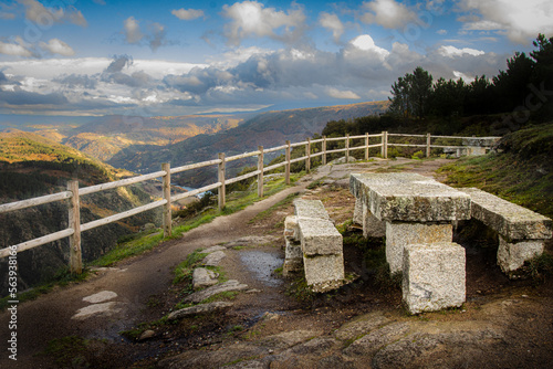 Stone picnic table looking over Sil river canyon landscape. Scenic view Ribeira Sacra. Balcones de Madrid, Ourense, Galicia, Spain