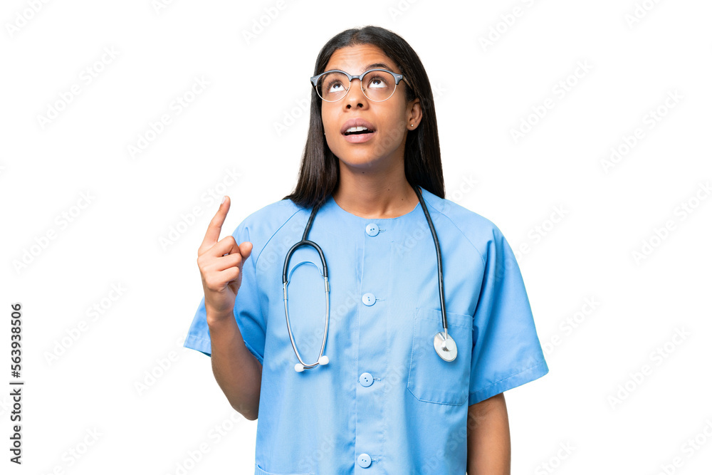 Young African american nurse woman over isolated background pointing up and surprised Young African american nurse woman over isolated background pointing up and surprised