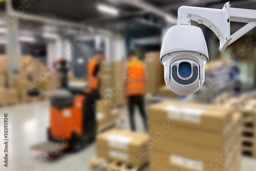 CCTV Camera Operating inside warehouse or factory. Copy space.