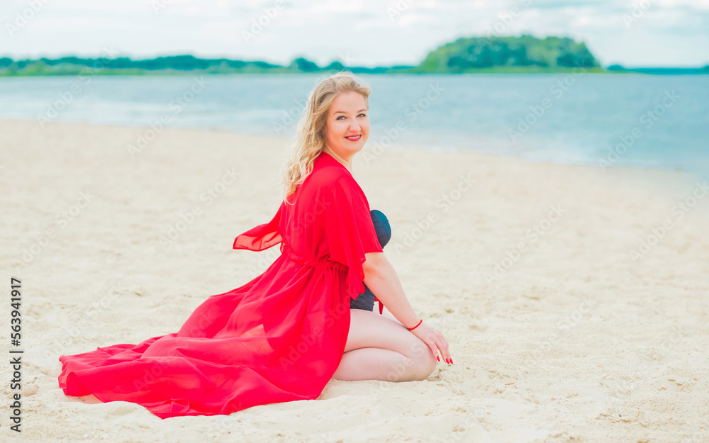 Plus size European blonde woman in stylish romantic women's summer clothes at beach. Concept of sizes, happy nice natural beautiful lady Plus size European blonde woman in stylish romantic women's summer clothes at beach. Concept of sizes, happy nice natural beautiful lady