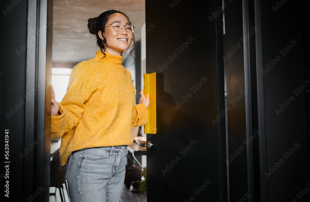 Entrance, creative and Asian woman opening a door to an office at a graphic design startup company. Vision, happy and Japanese designer at a workspace with an idea, motivation and inspiration