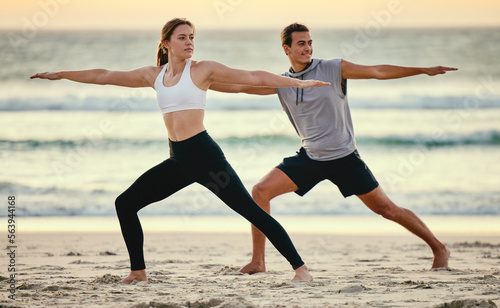 Warrior pose, couple and beach yoga at sunset for health, fitness and wellness. Exercise, zen chakra and man and woman stretching, training and practicing pilates for balance outdoors at seashore.